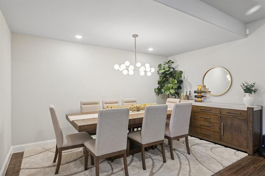 Dining area featuring light wood-type flooring, recessed lighting, and a chandelier Dining area featuring light wood-type flooring, recessed lighting, and a chandelier