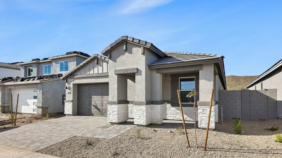 Representative exterior photo of a completed home built from the Hayden by D.R. Horton in The Ridge at Stone Butte, Phoenix, AZ (Image 25).