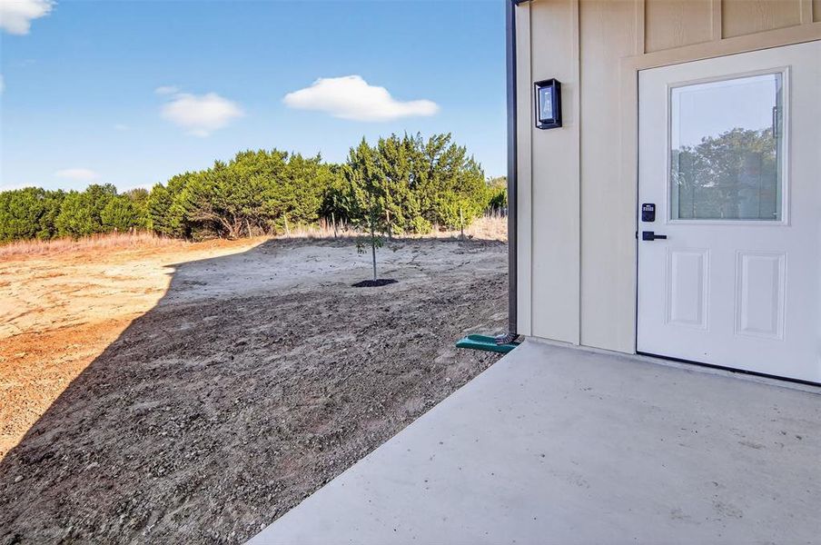 covered back porch with country view.