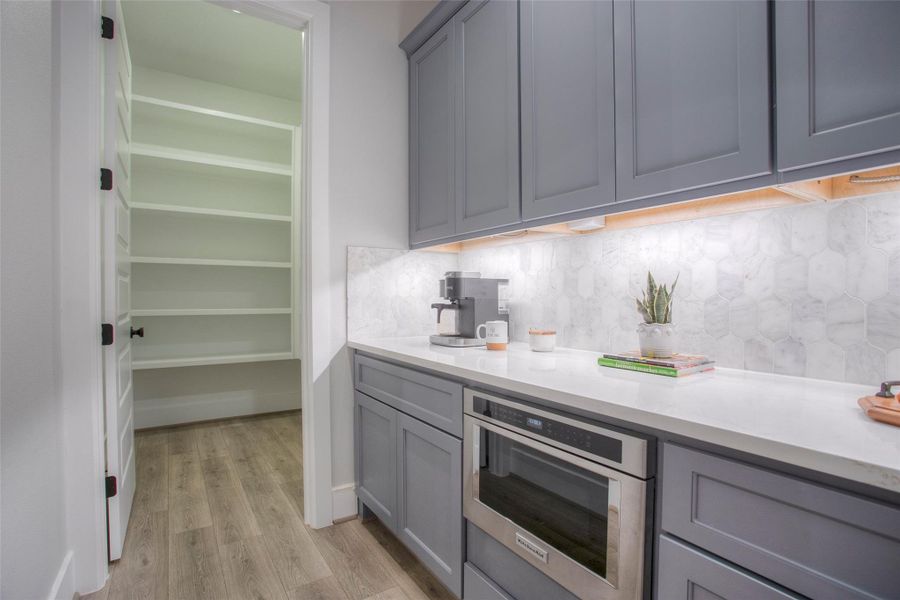 Large walk in pantry adjoins the butler pantry