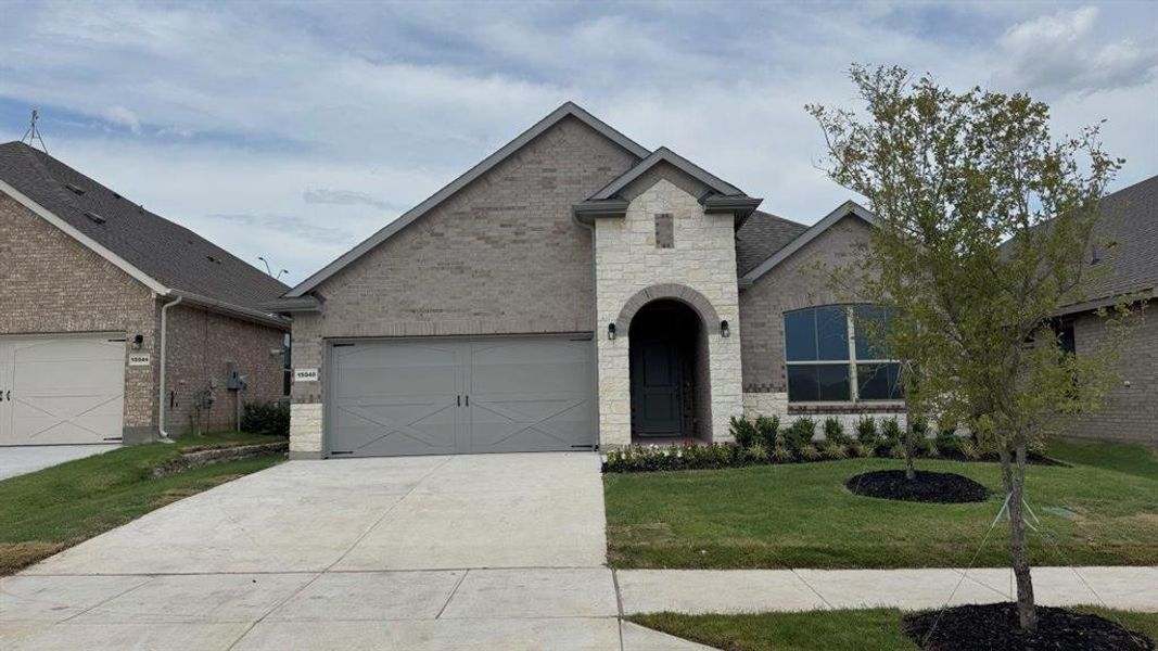 Front exterior of a new home in Morningstar, Fort Worth, TX, highlighting curb appeal (Image 1).