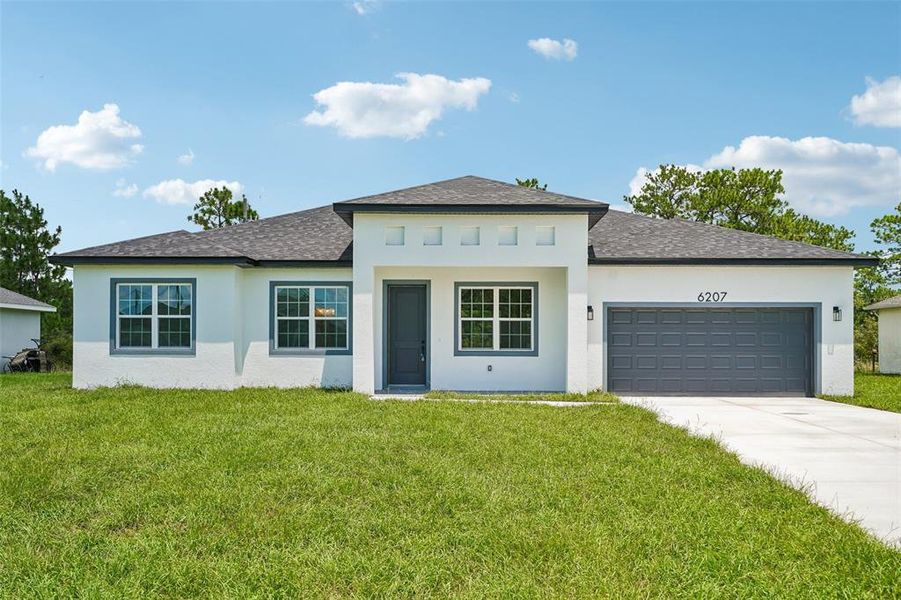 Front exterior of a new home in , Ocala, FL, highlighting curb appeal (Image 1). Front exterior of a new home in , Ocala, FL, highlighting curb appeal (Image 1).