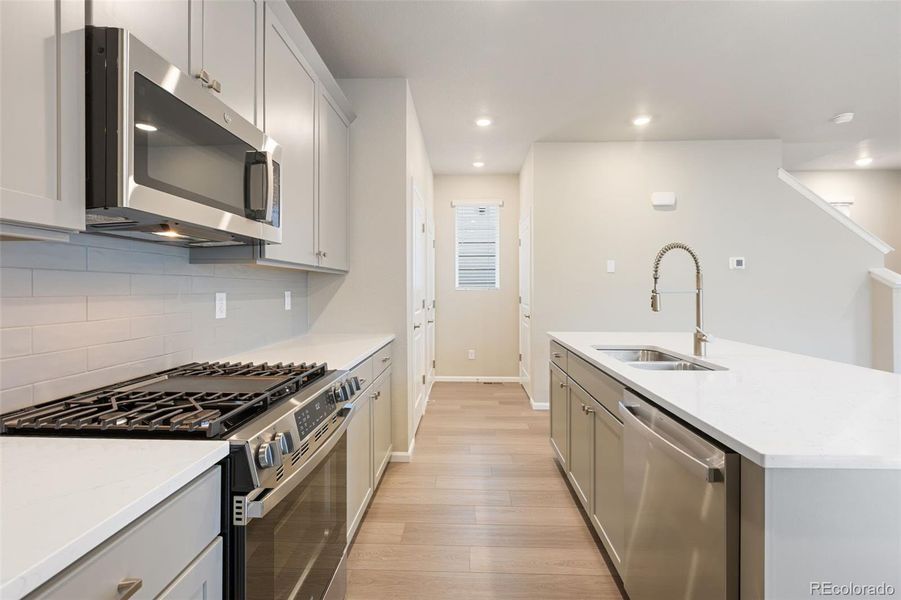 Furnished interior view inside a new home in Woodrose at Painted Prairie, Aurora (Image 5).