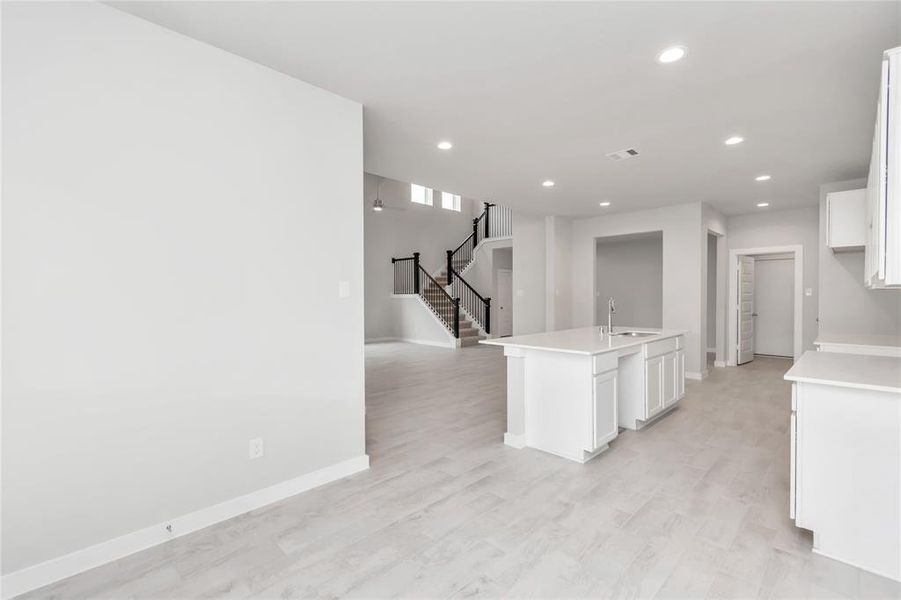 Enjoy breakfast with ease in the connected and cozy breakfast area, seamlessly integrated with the kitchen for utmost convenience. Sample photo of completed home with similar floor plan. As-built interior colors and selections may vary