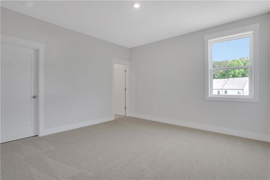 Spacious, unfurnished interior of a new home in The Paddocks at Doc Hughes, Buford (Image 26).