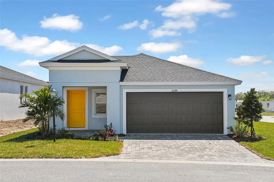Front exterior of a new home in Cherrywood Preserve, Ocala, FL, highlighting curb appeal (Image 1). Front exterior of a new home in Cherrywood Preserve, Ocala, FL, highlighting curb appeal (Image 1).