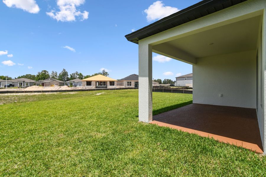 Front exterior of a new home in Avalon West, Spring Hill, FL, highlighting curb appeal (Image 56).