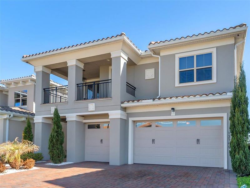 Front exterior of a new home in , Orlando, FL, highlighting curb appeal (Image 27).
