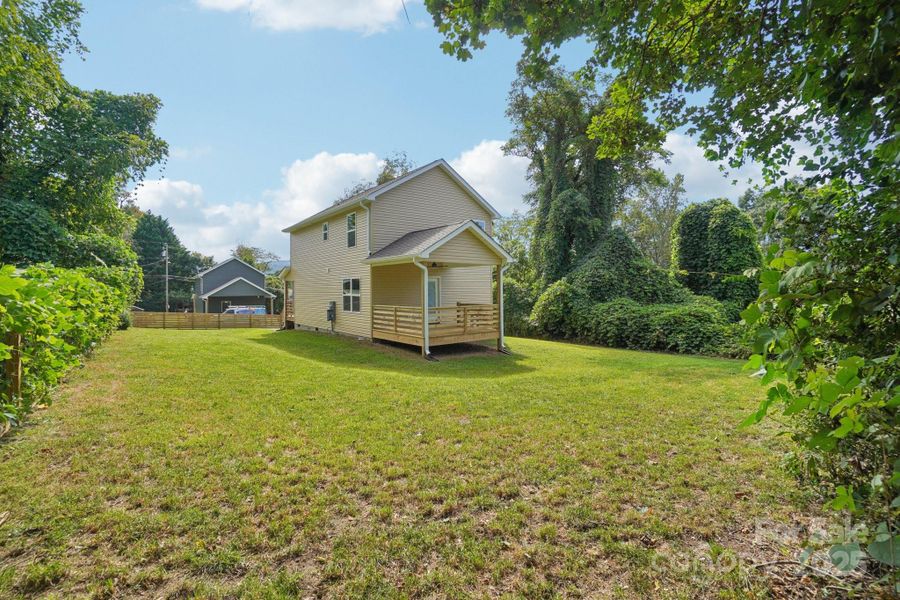 Lots of privacy in the back yard with covered deck off the dining area
