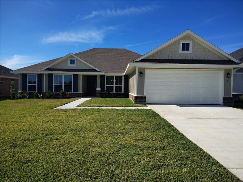 Front exterior of a new home in Greystone, Angleton, TX, highlighting curb appeal (Image 1). Front exterior of a new home in Greystone, Angleton, TX, highlighting curb appeal (Image 1).