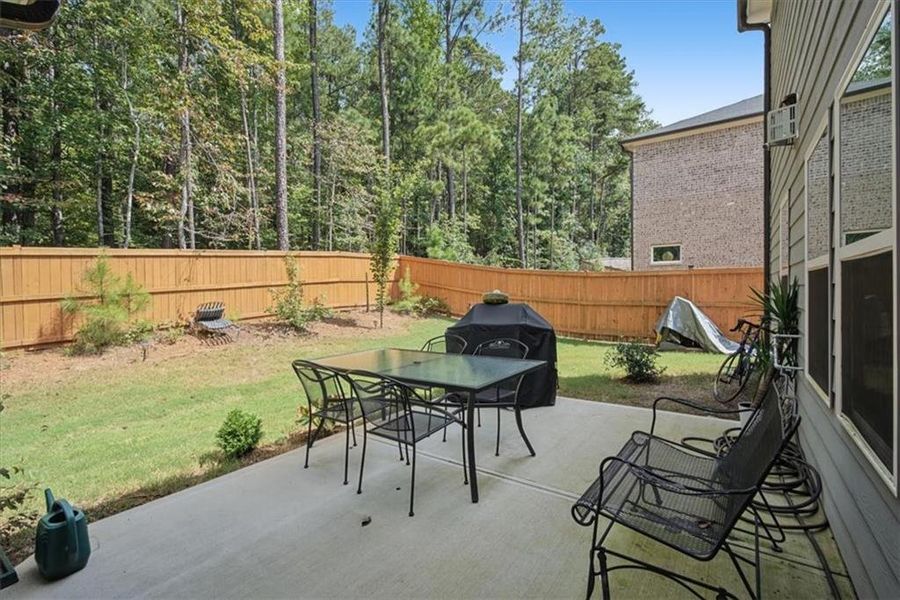 Exterior details and patio area of a home in Creekside at Oxford Park, Fairburn (Image 23).