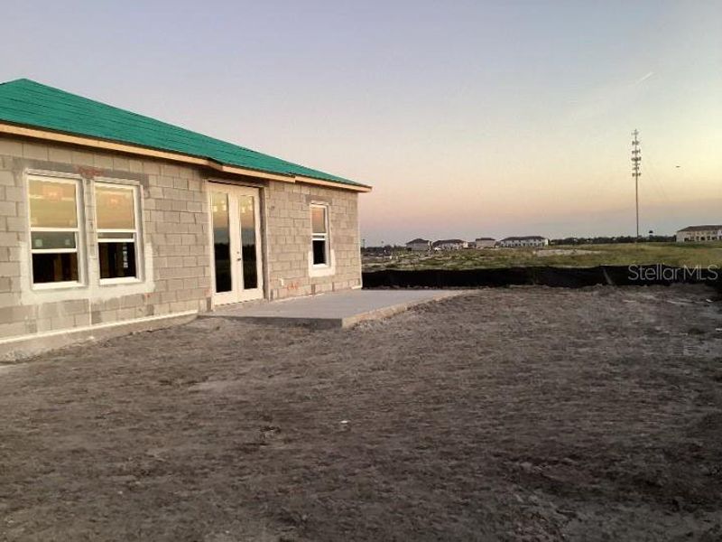 Exterior details and patio area of a home in Catamaran Cove Traditional, Rockledge (Image 4).