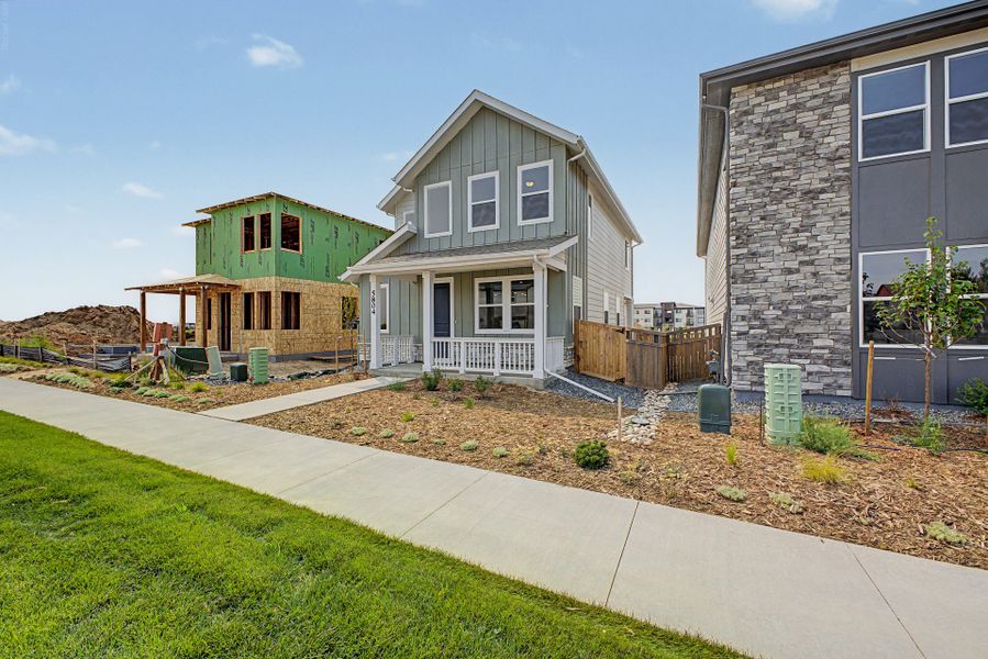 Front exterior of a new home in Painted Prairie, Aurora, CO, highlighting curb appeal (Image 11).