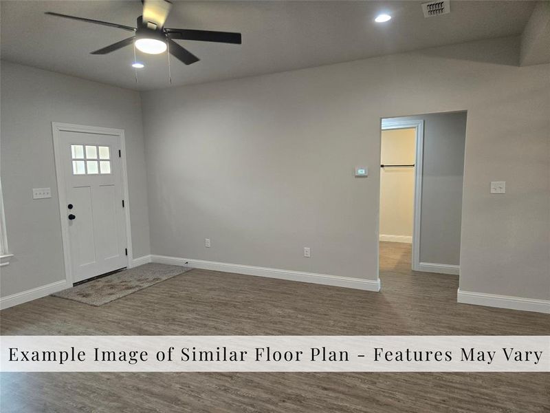 Foyer with dark wood finished floors, lofted ceiling, recessed lighting, and ceiling fan