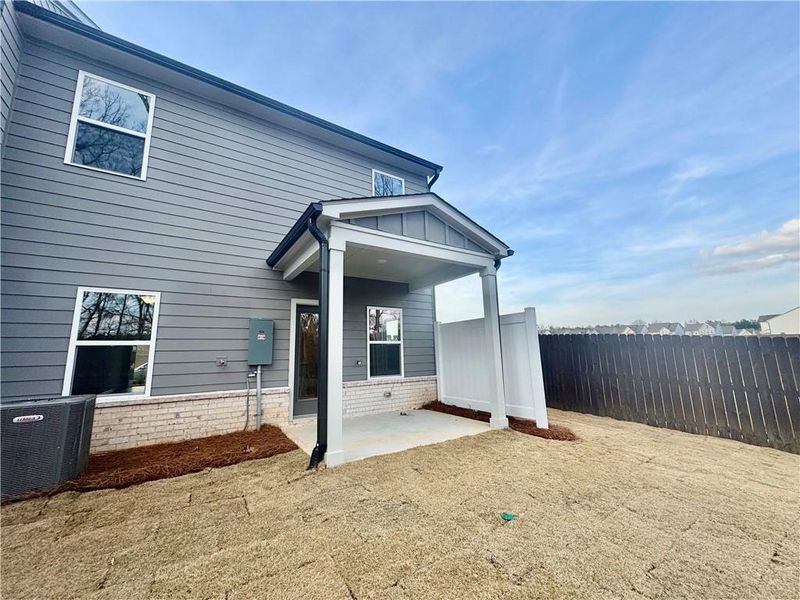 Exterior details and patio area of a home in Eastlyn Crossing, Flowery Branch (Image 4).