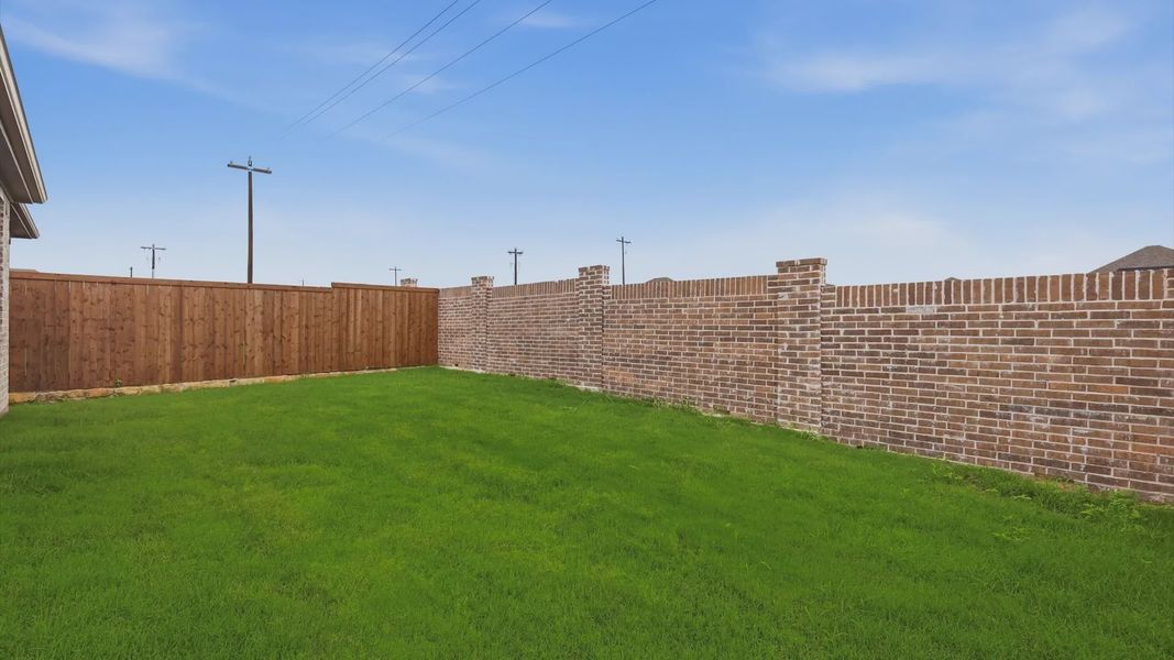 Exterior details and patio area of a home in Westridge Journey, Princeton (Image 28).