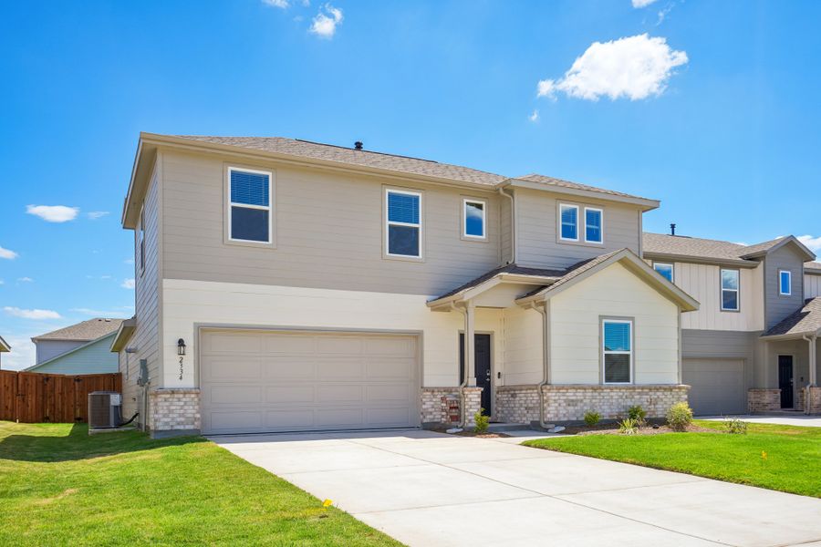 Front exterior of a new home in River Ridge, Crandall, TX, highlighting curb appeal (Image 2). Front exterior of a new home in River Ridge, Crandall, TX, highlighting curb appeal (Image 2).