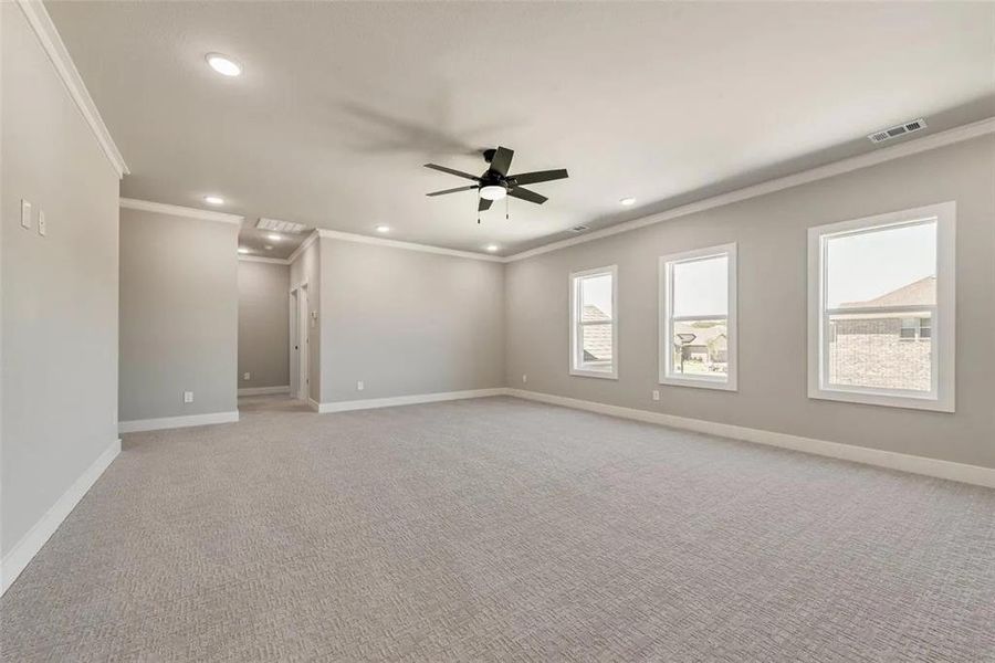 Unfurnished room featuring crown molding, ceiling fan, carpet flooring, and recessed lighting