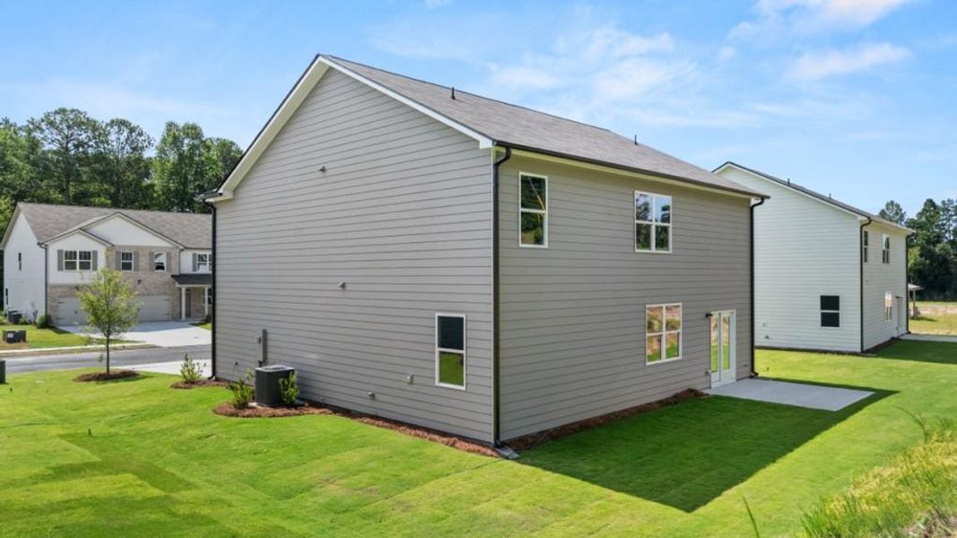 Front exterior of a new home in Northwoods at Mirror Lake, Villa Rica, GA, highlighting curb appeal (Image 24).