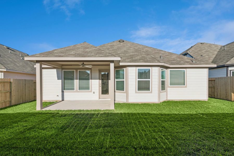 Exterior details and patio area of a home in Pinewood at Grand Texas, New Caney (Image 20).