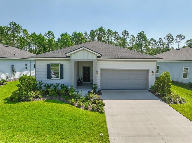Front exterior of a new home in , Palm Coast, FL, highlighting curb appeal (Image 1). Front exterior of a new home in , Palm Coast, FL, highlighting curb appeal (Image 1).