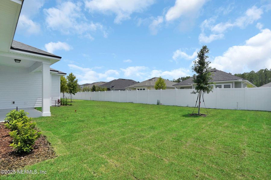 Exterior details and patio area of a home in Forest Park at Wildlight, Yulee (Image 23).
