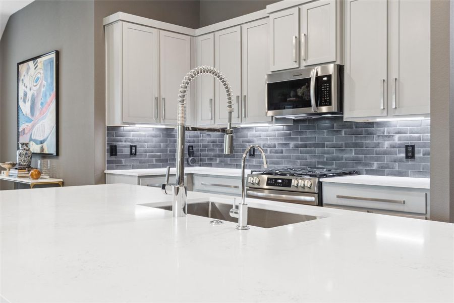 Commercial style faucet and under counter lighting