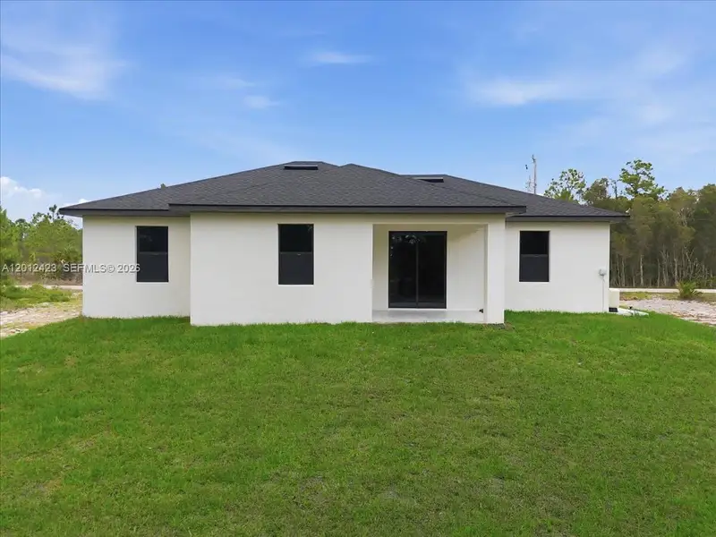 Exterior details and patio area of a home in , Lehigh Acres (Image 3).