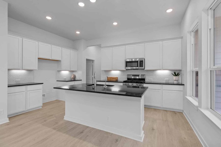 Representative furnished interior of a home built from the Ryker by Chesmar Homes in The Crossvine – Garden Homes, Schertz (Image 4).