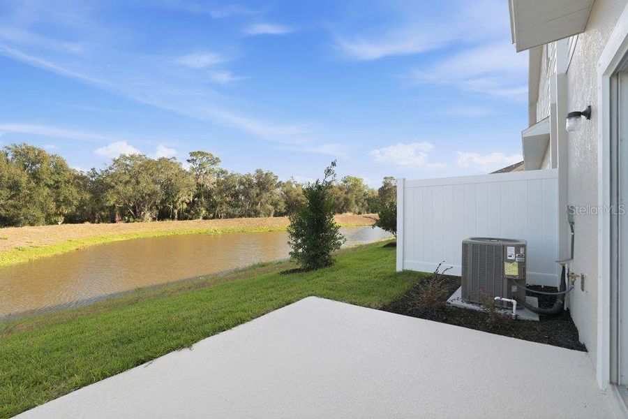 Exterior details and patio area of a home in The Towns at Firethorn, Parrish (Image 29).