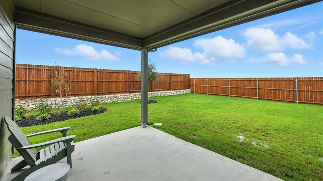 Exterior details and patio area of a home in Monarch at the Meadows, Denton (Image 3). Exterior details and patio area of a home in Monarch at the Meadows, Denton (Image 3).