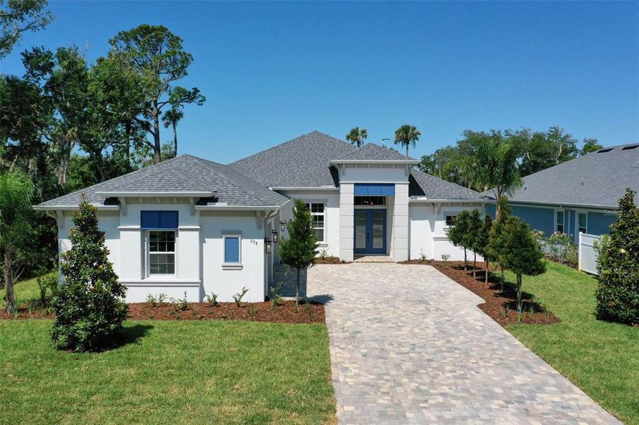 Front exterior of a new home in , Palm Coast, FL, highlighting curb appeal (Image 2). Front exterior of a new home in , Palm Coast, FL, highlighting curb appeal (Image 2).