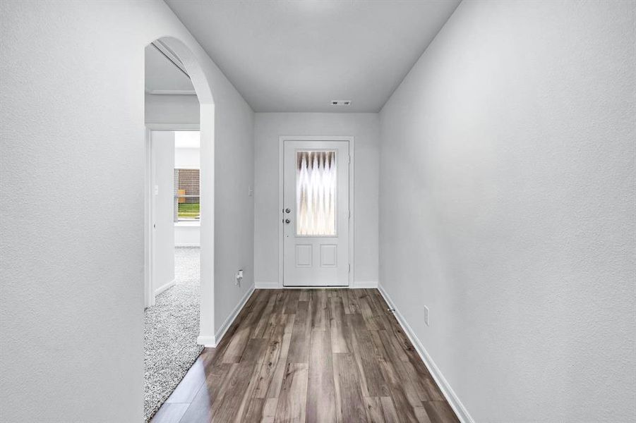 Entryway featuring carpet floors