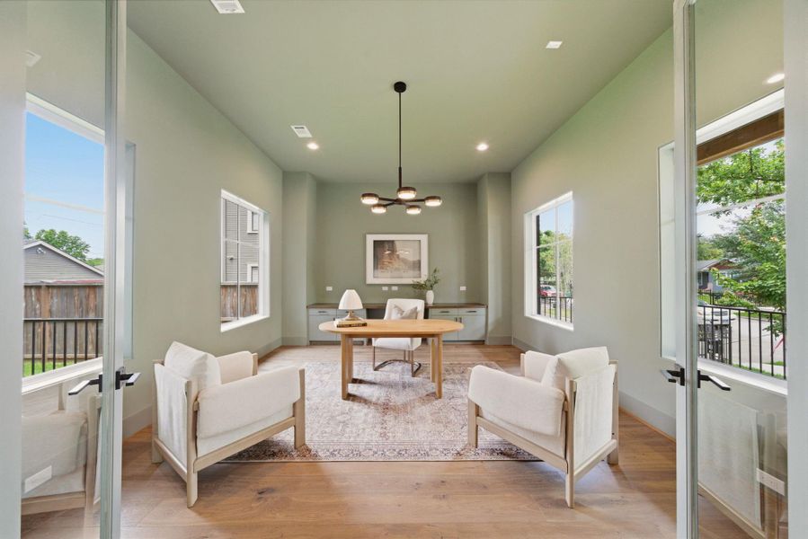 Private office with oversized windows, designer lighting, and elevated modern finishes. Helpful built-ins and glass doors for privacy.