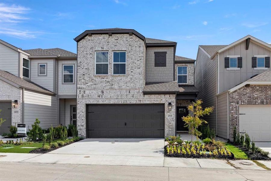 Front exterior of a new home in Sereno Oaks at Buckner Terrace, Dallas, TX, highlighting curb appeal (Image 19). Front exterior of a new home in Sereno Oaks at Buckner Terrace, Dallas, TX, highlighting curb appeal (Image 19).