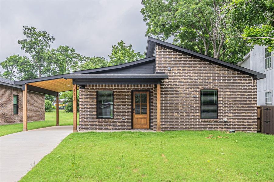 Front exterior of a new home in , Denison, TX, highlighting curb appeal (Image 16). Front exterior of a new home in , Denison, TX, highlighting curb appeal (Image 16).