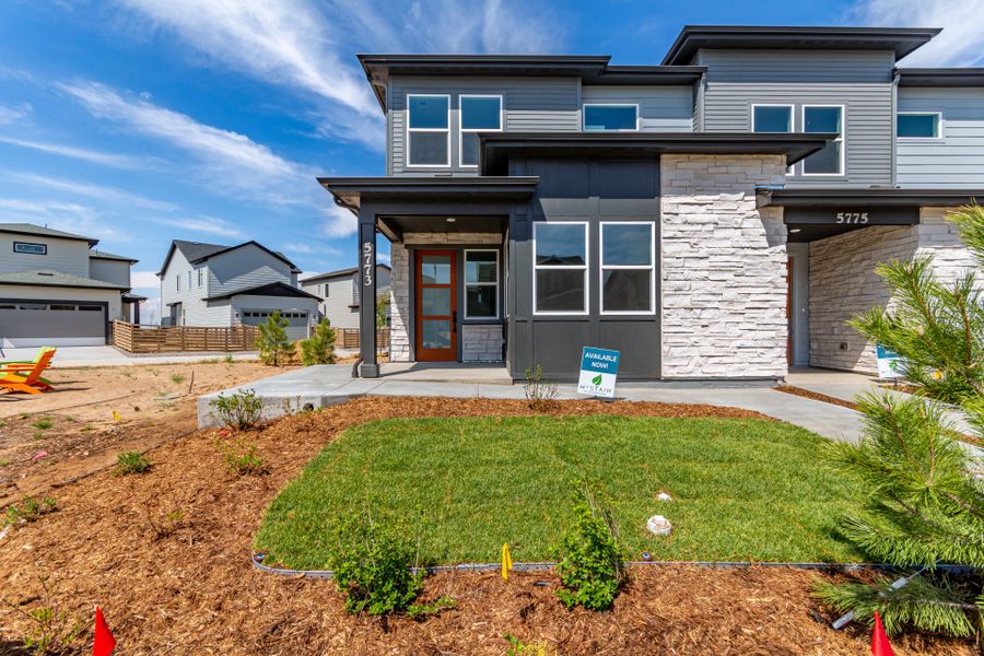 Front exterior of a new home in Painted Prairie, Aurora, CO, highlighting curb appeal (Image 1). Front exterior of a new home in Painted Prairie, Aurora, CO, highlighting curb appeal (Image 1).