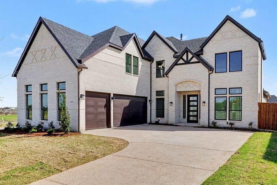 Front exterior of a new home in , Prosper, TX, highlighting curb appeal (Image 2). Front exterior of a new home in , Prosper, TX, highlighting curb appeal (Image 2).