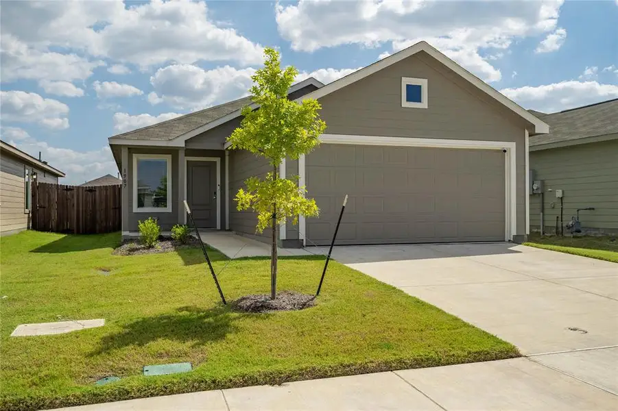 Front exterior of a new home in Eastland, Crandall, TX, highlighting curb appeal (Image 1). Front exterior of a new home in Eastland, Crandall, TX, highlighting curb appeal (Image 1).