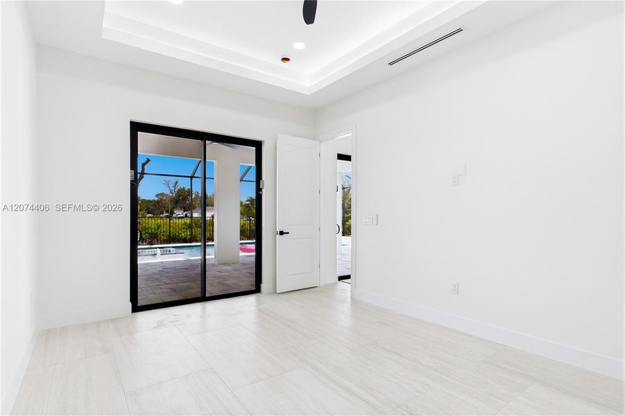 LARGE PRIMARY SUITE w/ sliding doors to lanai, WALK-IN CLOSET w/ BUILT-IN SHELVING & HANGING RACKS & LUXURIOUS PRIMARY BATHROOM LARGE PRIMARY SUITE w/ sliding doors to lanai, WALK-IN CLOSET w/ BUILT-IN SHELVING & HANGING RACKS & LUXURIOUS PRIMARY BATHROOM