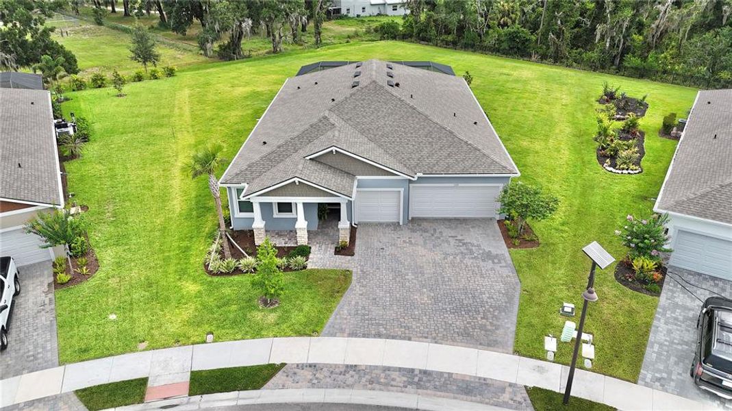 Front exterior of a new home in Windwater, Parrish, FL, highlighting curb appeal (Image 26). Front exterior of a new home in Windwater, Parrish, FL, highlighting curb appeal (Image 26).