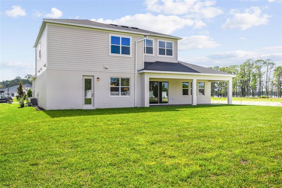 Exterior details and patio area of a home in Solace at Corner Lake, Orlando (Image 32).
