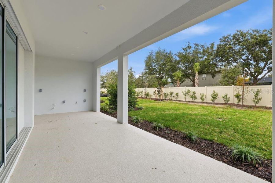 Exterior details and patio area of a home in Esplanade at Wiregrass Ranch, Wesley Chapel (Image 3). Exterior details and patio area of a home in Esplanade at Wiregrass Ranch, Wesley Chapel (Image 3).