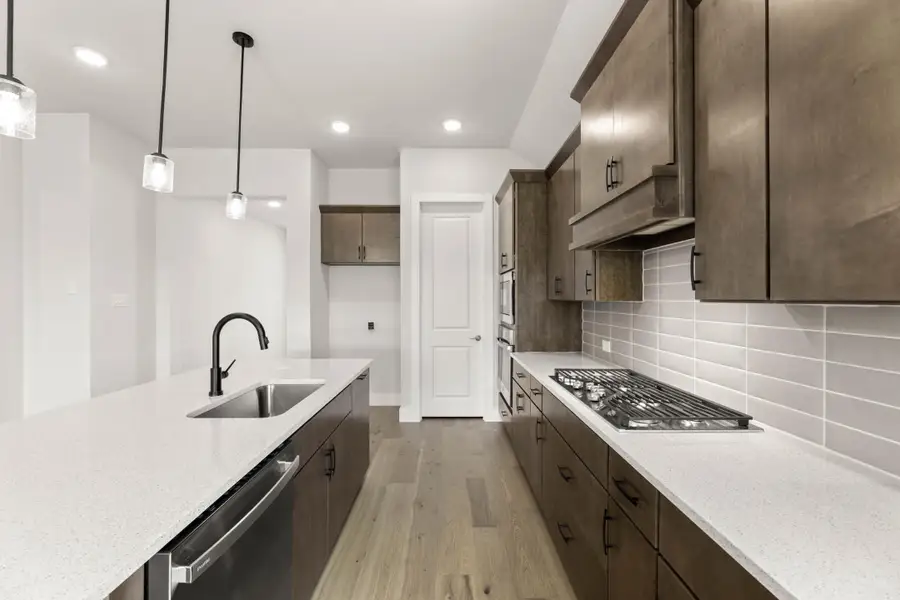 Representative furnished interior of a home built from the Aspen by Tri Pointe Homes in Treeline, Justin (Image 6).