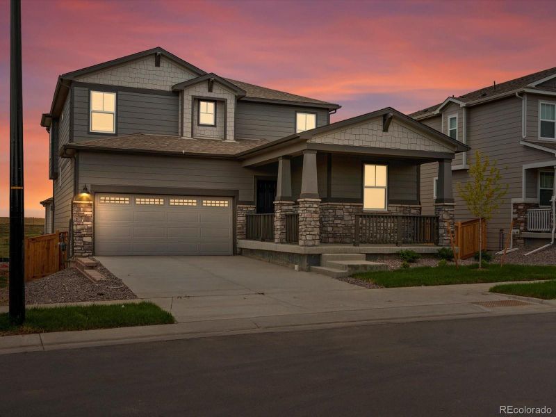 Front exterior of a new home in Buffalo Highlands: The Flora Collection, Commerce City, CO, highlighting curb appeal (Image 16). Front exterior of a new home in Buffalo Highlands: The Flora Collection, Commerce City, CO, highlighting curb appeal (Image 16).