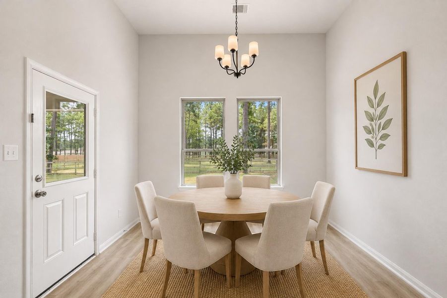 Bright and inviting dining area with large windows offering scenic outdoor views of your backyard retreat. *Virtually staged