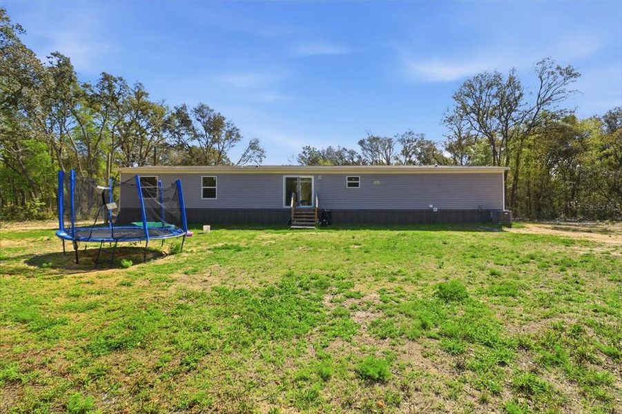 Exterior details and patio area of a home in , Bronson (Image 23).