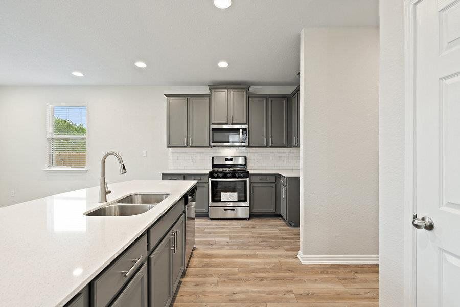 Photos are of a completed model of the same floor plan and are for illustrative purposes only. Actual home is under construction and design selections, materials, and features may differ. Confirm final specifications with the New Home Consultant.