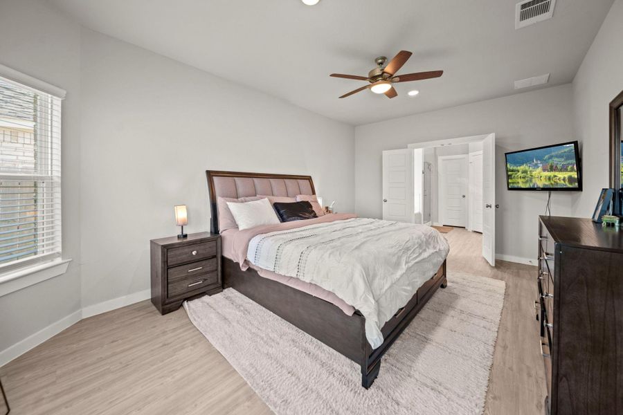Spacious primary bedroom with ensuite bathroom Spacious primary bedroom with ensuite bathroom