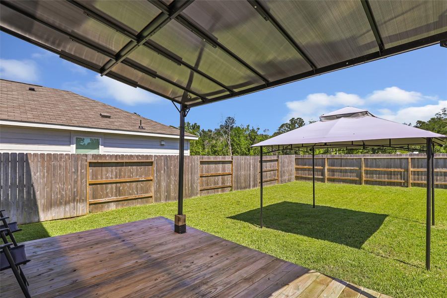 Love the deck and covered areas in the back yard. Lots of options back here for landscaping and it is large enough for a pool.